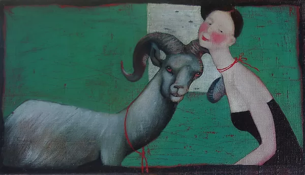 A girl with a goat